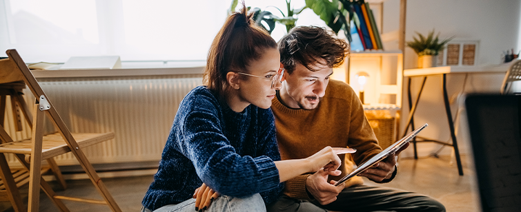 Image of man and woman on computer accessing Locke Funeral Service Planning Center